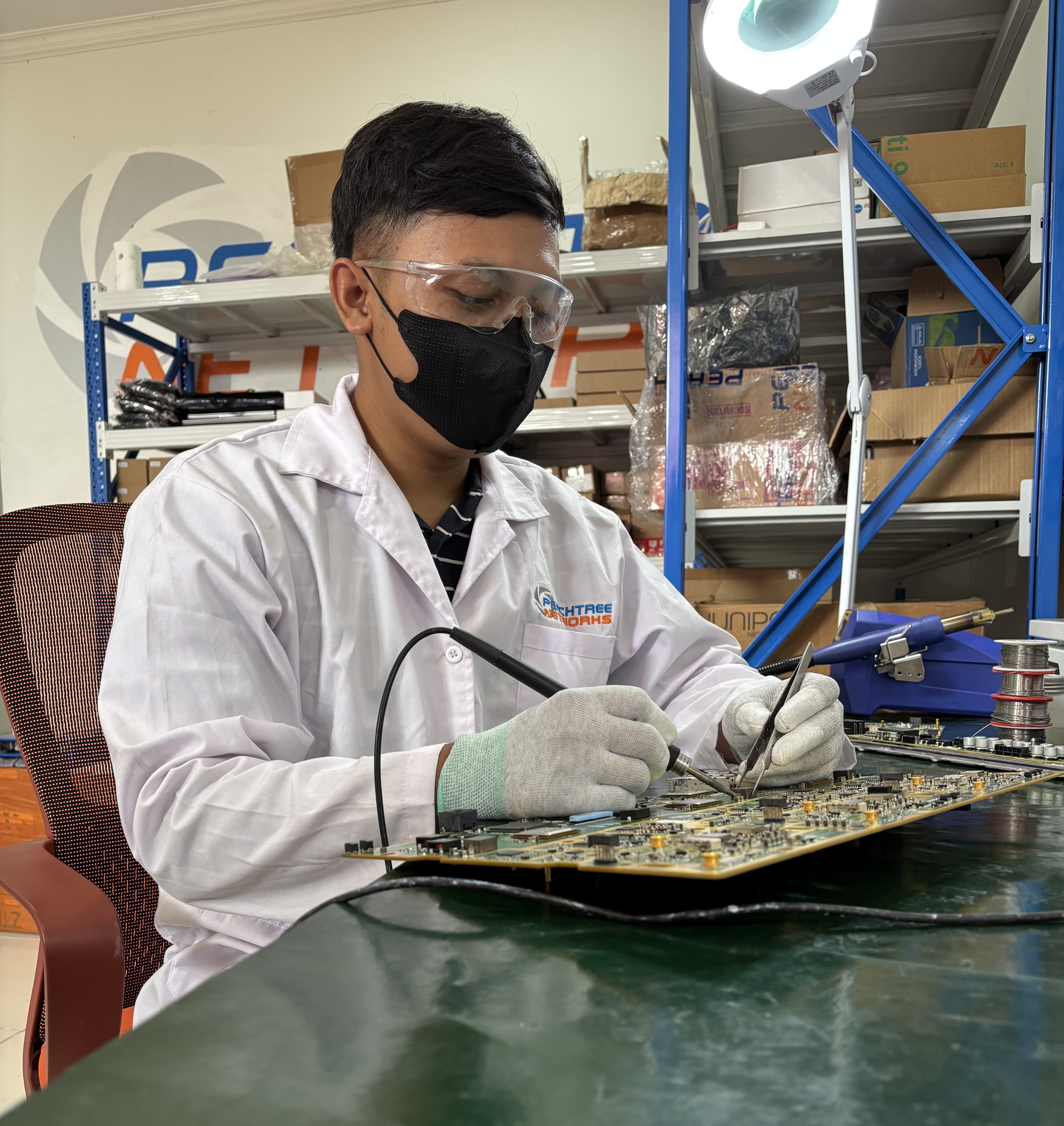 PTNW engineer soldering PCB board
